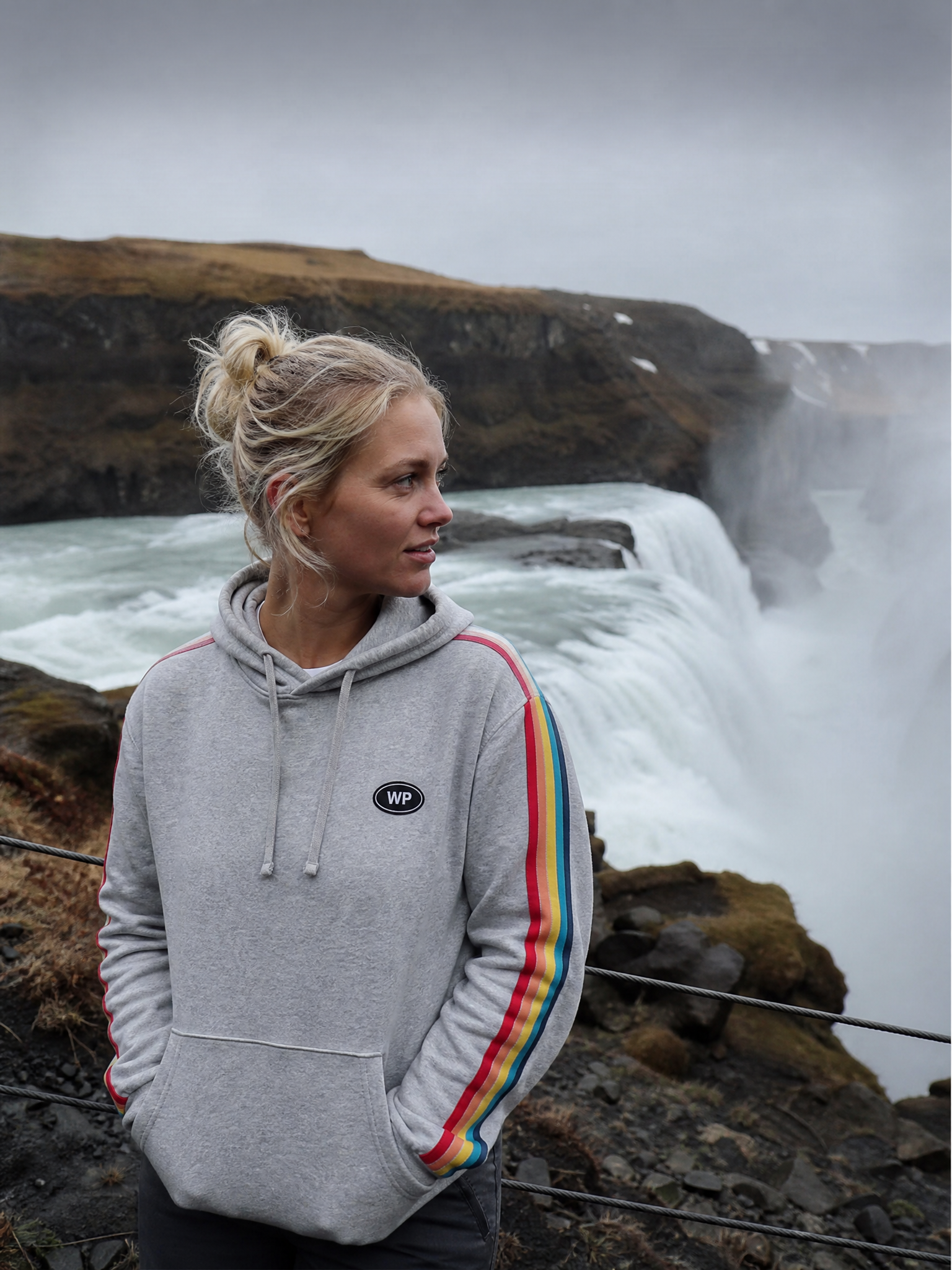 Erika L. wearing Wunderpath gear at Seljalandsfoss, Iceland